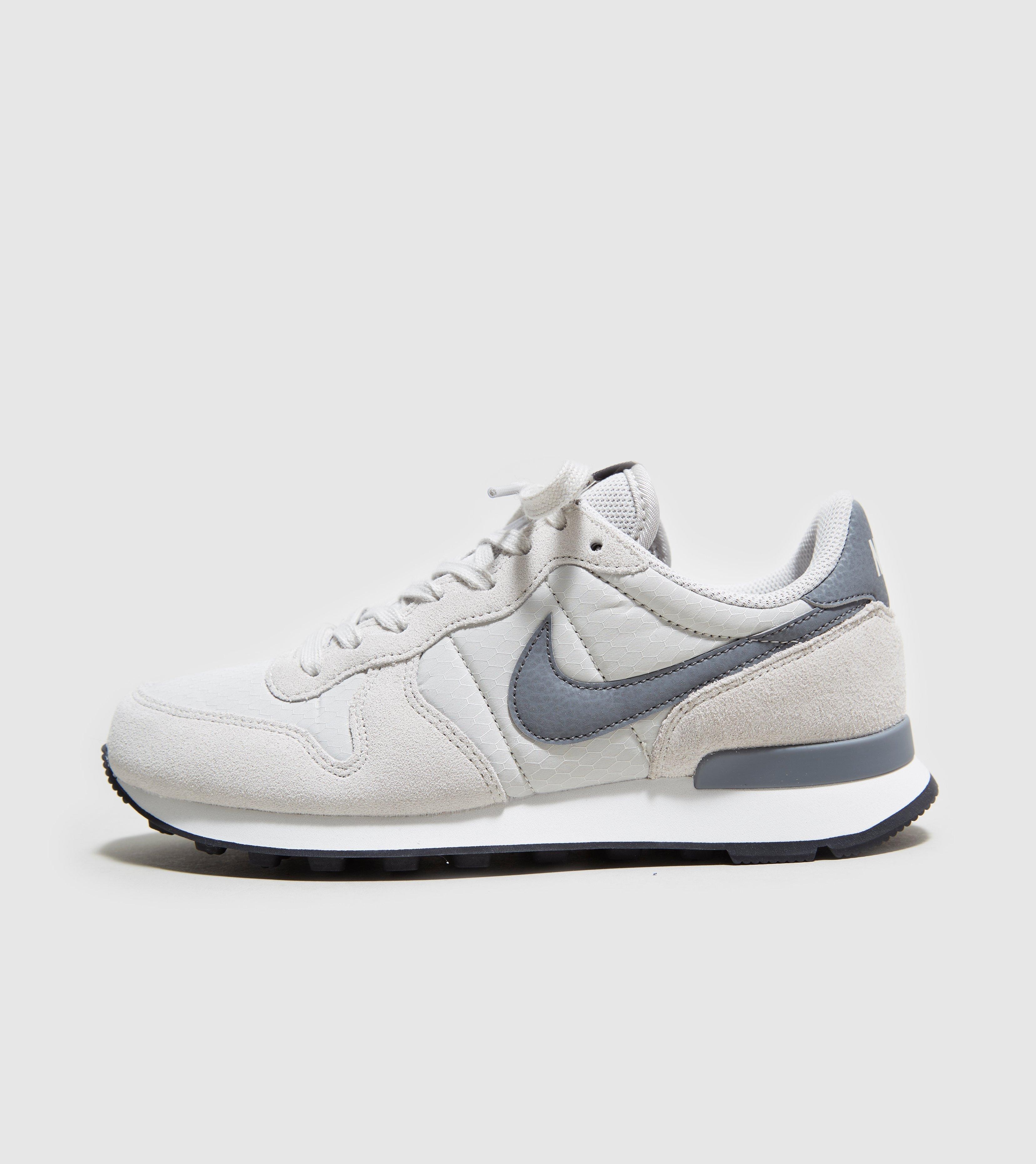 nike internationalist femme blanche doré